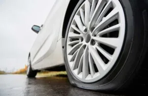 -punctured-car-tire-roadside